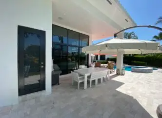 backyard of nice south florida house with impact windows and doors